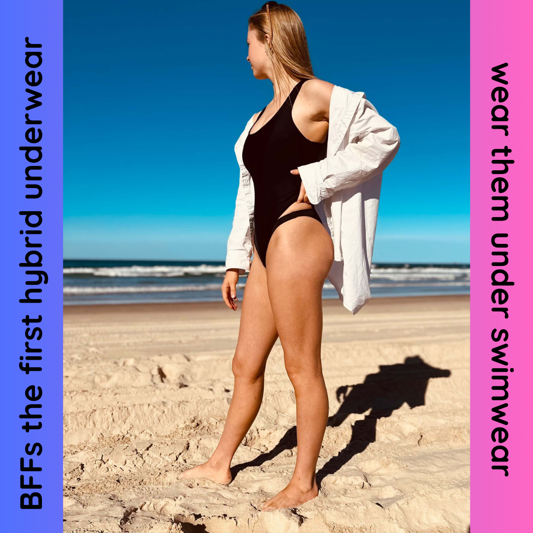 Teen girl on beach wearing BFFs for period protection under her one piece